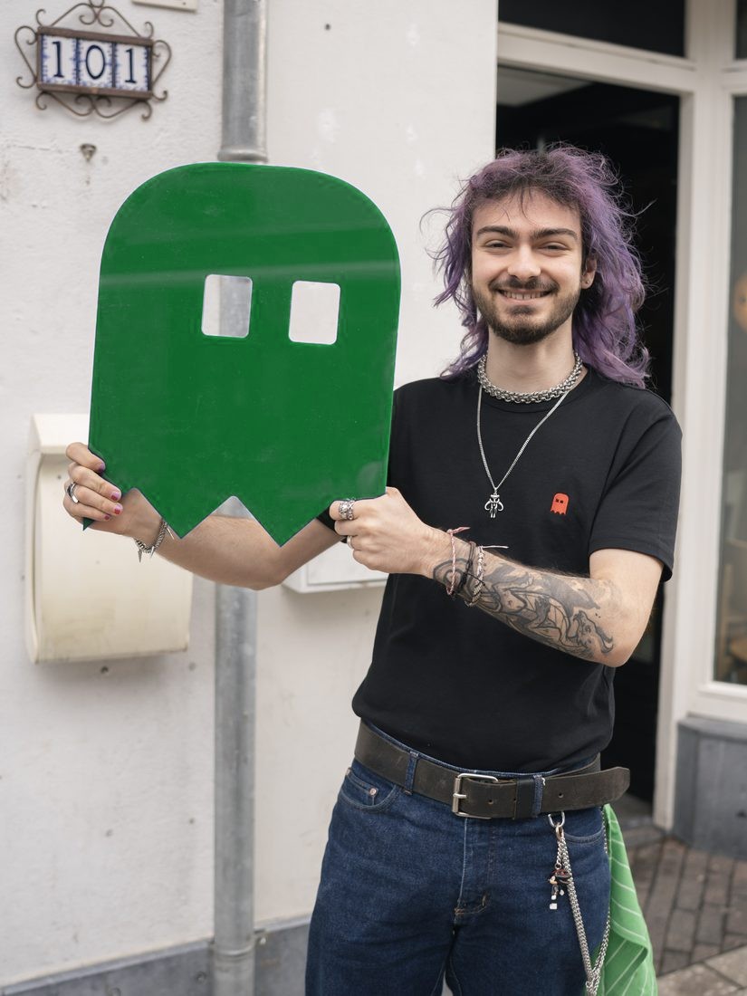 Barkeet host holding a green ghost